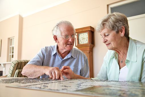Elderly Couple With A Puzzle